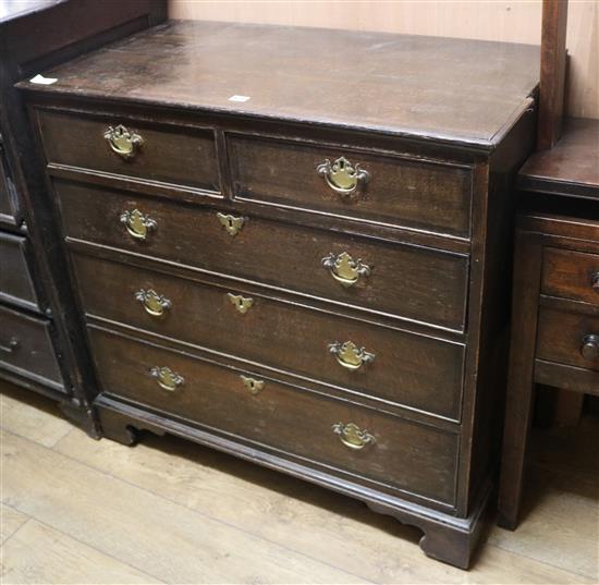 A George III oak chest of drawers W.98cm